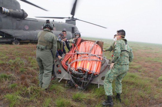 The Singapore Armed Forces helping out in water-bombing efforts in Palembang on Oct 11, 2015. — TODAY pic