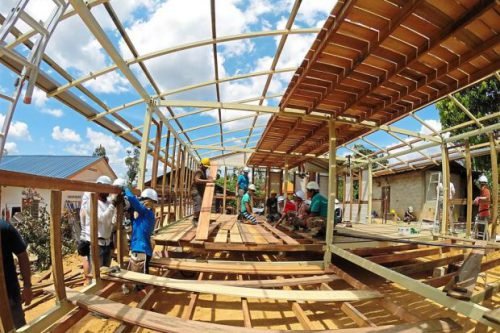 Volunteers undertaking the task of building and completing a home in three days under an Epic Homes programme. (Photo from Epic Homes, taken from The Star)