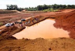 The disused bauxite mining pond which had claimed the lives of three children on Saturday. - BERNAMApic